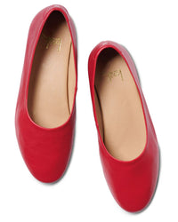 A top view of the beek.. Swiftlet in Lipstick: red leather ballet flats featuring a memory foam footbed and tan insoles.