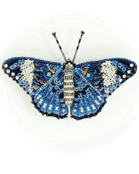The Trovelore Blue Calico Cracker Butterfly Brooch Pin features intricate hand embroidery with blue, white, black, orange, and silver beads forming detailed patterns on its wings and body against a plain white background.