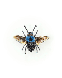The Trovelore Blue Carpenter Bee Brooch Pin is hand embroidered with blue, black, gold, and brown beads and sequins to resemble a bee, shown on a white background.