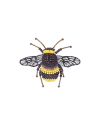 The Trovelore Bumblebee Brooch Pin is handmade in India, featuring black and yellow beadwork, translucent wings with black stitching, and metallic antennae on a white base.