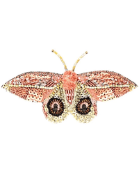 Trovelore’s Dognin's Bullseye Moth Brooch Pin is a hand-embroidered accessory, crafted in India with pink, gold, and cream sequins and beads to capture the delicate details of a moth’s wings and body.