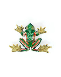 Trovelore Green Flying Frog Brooch Pin features gold, green, red, and black beads in a scale-like pattern. Viewed from above on a white background, its wide-spread toes evoke the look of a flying frog.
