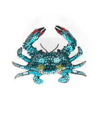 The Trovelore Jimmy Blue Crab Brooch Pin is a decorative crab figurine, hand embroidered with blue, teal, and black beads accented in red, displayed on a white background.