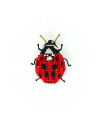 The Trovelore Lady Bug Beetle Brooch Pin features hand embroidery with red, black, and white beads and gold wire antennae, shown on a white background.