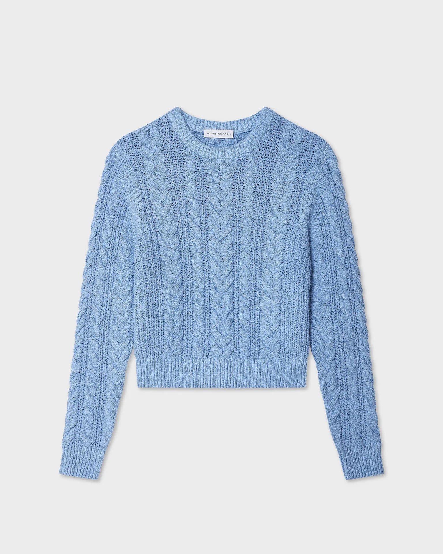 The Cotton Slub Cable Crew in Soft Blue by White & Warren showcases classic cable knit details, long sleeves, and a crew neckline, displayed flat on a white background.