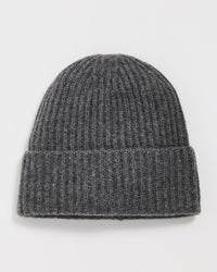 The Cashmere Plush Rib Beanie in Dark Slate Heather by White + Warren, featuring a ribbed cashmere knit and folded brim, is laid flat on a white surface.