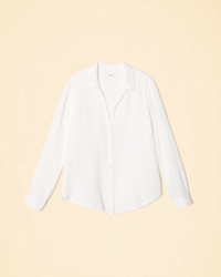 The Scout L/S Shirt in White by XiRENA, made from textured cotton gauze, is shown flat on a light beige background.