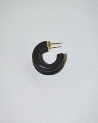 The B&L C Hoop in Mini in Midnight Panther is a single black, chunky crescent-shaped mango wood earring with a gold post, displayed on white to highlight its handmade, sustainably sourced artisan design.
