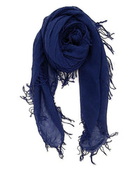 The Chan Luu Cashmere & Silk Scarf in Medieval Blue features frayed edges and is loosely rolled, displayed on a white background.