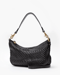 The Clare V. Moyen Messenger in Black Zig Zag is a black leather woven shoulder bag with gold hardware and a detachable long strap to convert it into a crossbody, shown against a plain white background.