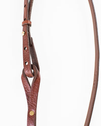 A close-up of the Depalma Handsewn Nouva 1/2 inch Single Wrap in Bark/Brass shows its genuine leather strap with brass studs and punched holes, looped to display texture and craftsmanship against a white background.