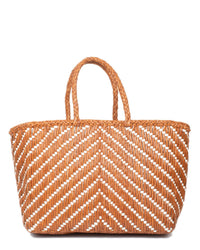 The Kumari Basket - Big in Tan/White by Dragon Diffusion is a woven tote with two handles and a chic chevron pattern. Its structured shape and roomy interior combine style with practicality.