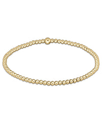 The enewton Classic Gold 2.5mm Bead Bracelet features small, evenly spaced round beads in a simple, elegant design—perfect for everyday wear.