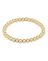 The Classic Gold 5mm Bead Bracelet by enewton features polished 14k gold-filled beads arranged in a seamless loop, shown against a white background.
