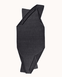 The Épice Uni 2 Scarf in Charcoal is displayed flat against a light background, its medium-weight cashmere fabric forming irregular folds for an abstract, geometric look with subtle texture.