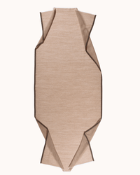 The Uni 3 Scarf in Caramel by Épice is a beige, oval woven scarf with pointed corners and dark brown trim. Shown laid flat on a light background, its edges extend outward for a geometric, folded look.