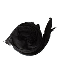 The Grisal Love Cashmere Scarf in Black, a luxury knit accessory with frayed edges, is rolled into a spiral and displayed on a white background.
