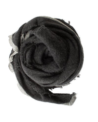 The Rosa Cashmere Scarf in Charcoal x Heather Grey by Grisal is shown rolled in a circle, featuring fringed and frayed edges, displayed on a white background.