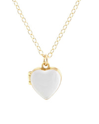 The Kris Nations Heart Enamel Locket in White is a gold vermeil necklace with a glossy, heart-shaped locket pendant, shown against a plain white background.