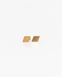 Diamond Stud Earrings in Gold by Nashelle, featuring small 14K gold fill button studs, displayed against a plain white background.