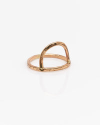 The Rising Sun Ring in Gold by Nashelle showcases a minimalist 14k gold fill band with two arched bars in an open geometric design. Expertly crafted in the USA, it’s displayed on a white background.