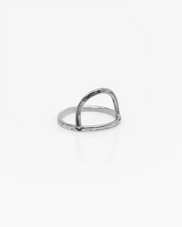 The Nashelle Rising Sun Ring in Silver features a thin, textured band with a simple arched design, shown on a plain white background.