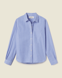 The Trovata Birds of Paradis Grace Classic Shirt in Blue/White Stripe features a light blue base with thin white stripes, long sleeves, a classic collar, chest pocket, and is crafted from 100% cotton—shown on a plain beige background.