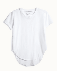 The Theo Tee in White by Frank & Eileen features short sleeves, a crew neckline, and a curved raw hem. The shirt is laid flat against a light background.