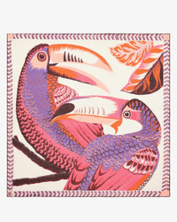 Colorful illustration of two toucans in pink, purple, and orange with stylized leaves frames the Square 130 Toucan in Pink by Inoui Editions—perfect as a silk cashmere scarf or oversized bandana, finished with a decorative border.