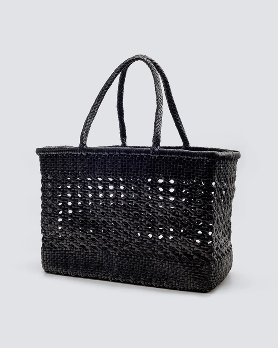 Cannage Max in Black handwoven leather tote bag by Dragon Diffusion against a neutral background.