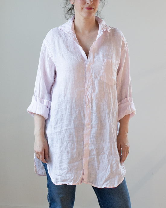 Woman standing in a casual pose wearing a Marella Tunic Blouse in Pink Stripe Linen from CP Shades and blue jeans.