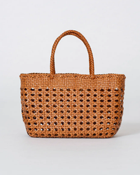 Dragon Diffusion Cannage Kanpur Big tote handwoven leather bag on a neutral background.