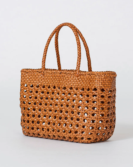 Handwoven leather Cannage Kanpur Big tote by Dragon Diffusion on a plain background.