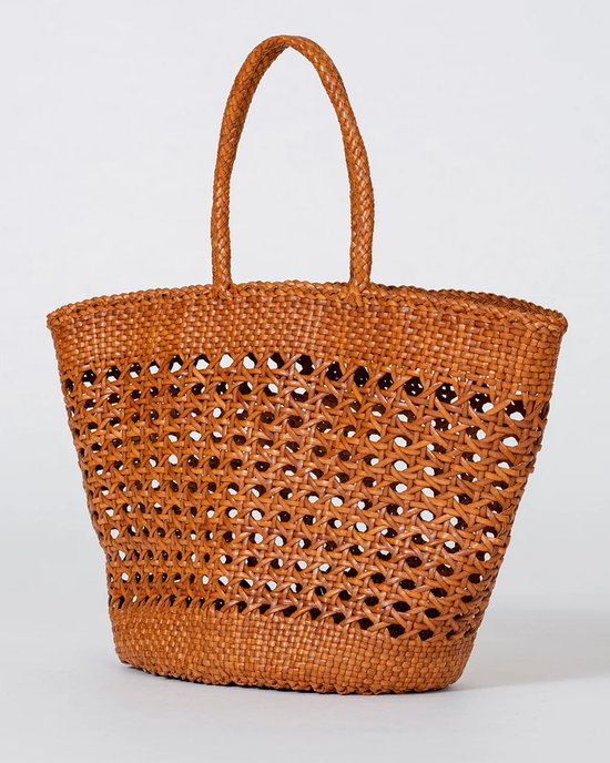 Handwoven leather tote with openwork design on a plain background - Cannage Market XL in Tan by Dragon Diffusion.