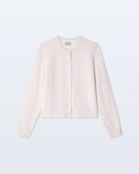 The Cashmere Crewneck Cardigan in Soft White by White + Warren features long sleeves, a button-up front, and a round neckline, shown laid flat against a pale background.