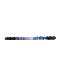 A Karen Lazar Design 2MM Sig Bracelet with Blue Sapphire Ombre & Yellow Gold featuring a gradient of beads transitioning from black to blue to white colors, complemented by 14k Yellow Gold filled beads, against a white background.