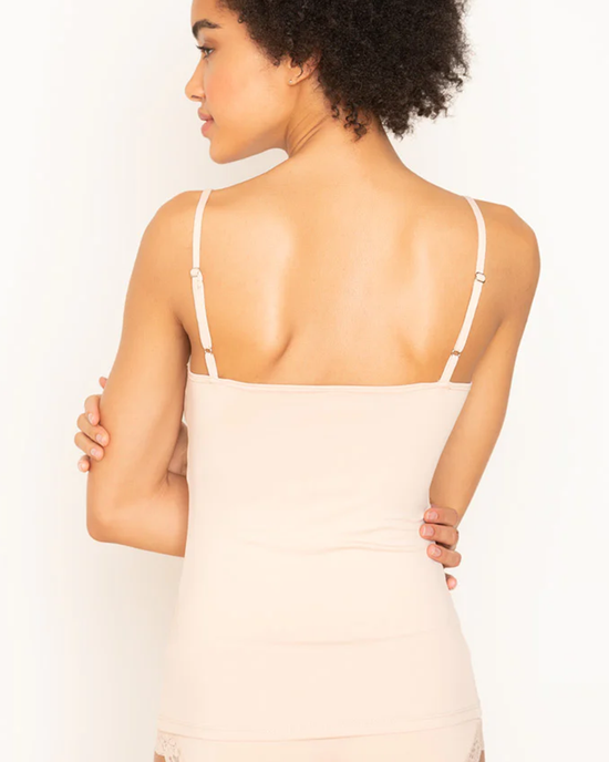 A woman seen from behind, wearing a delicious beige Del Adjustable Strap Cami in Cream by Only Hearts.