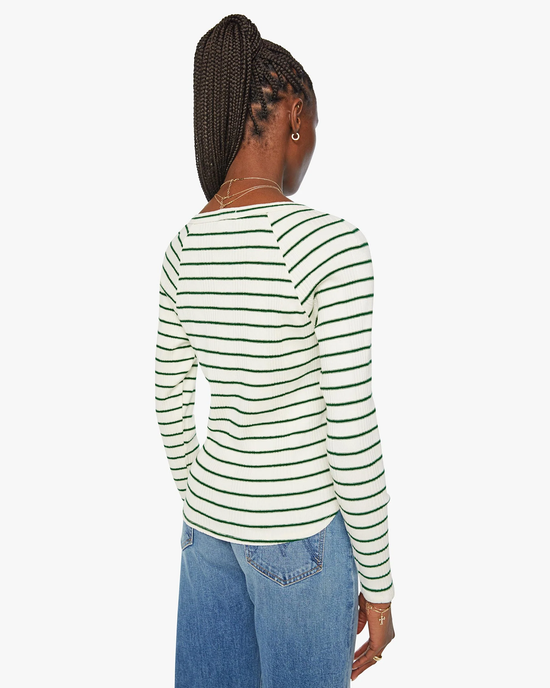 A person seen from behind wearing a Mother Split Varsity Long Sleeve in High Road Stripe and blue jeans.