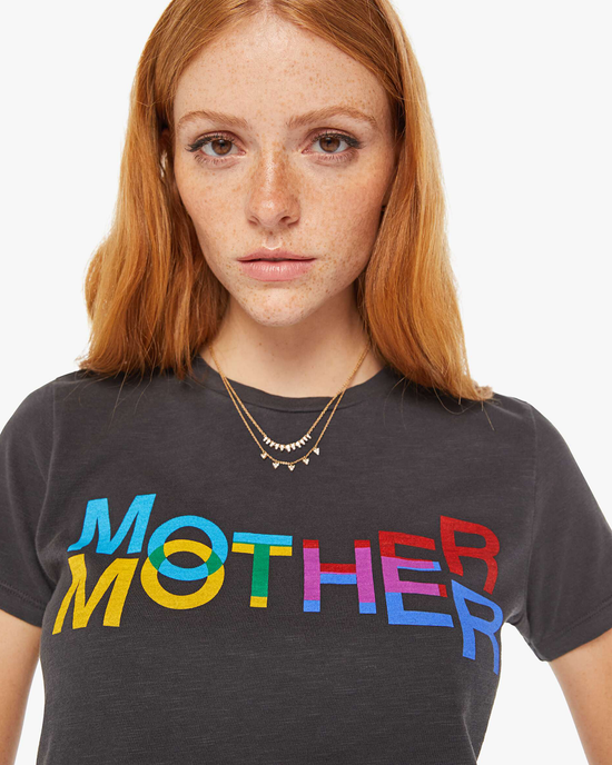 A woman with freckles wearing The Lil Sinful in Mother Kaleidoscope by Mother, with the word "mother" printed in colorful letters.