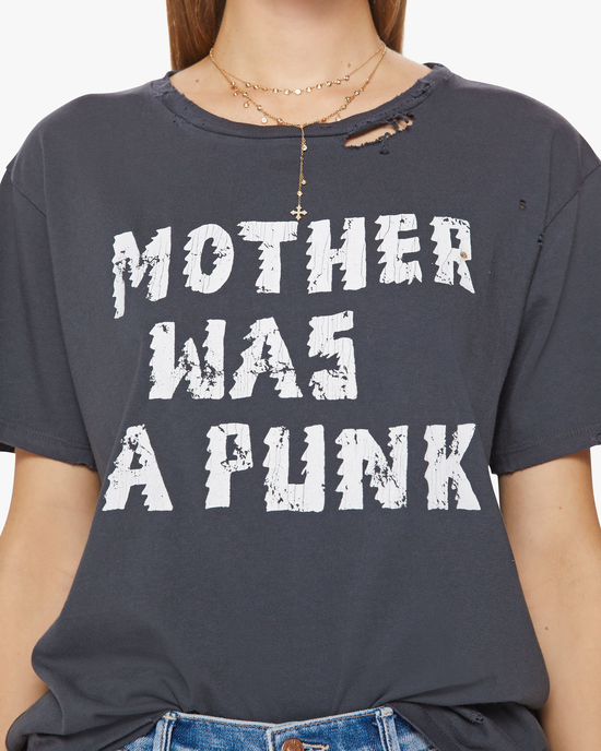 Woman wearing a distressed navy Mother Tee with the text "mother was a punk" printed in white.