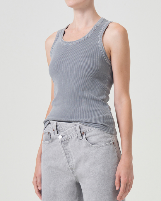 Woman in a gray AGOLDE Poppy Scoop Neck Tank in Mirror Ball and light gray jeans against a white background.
