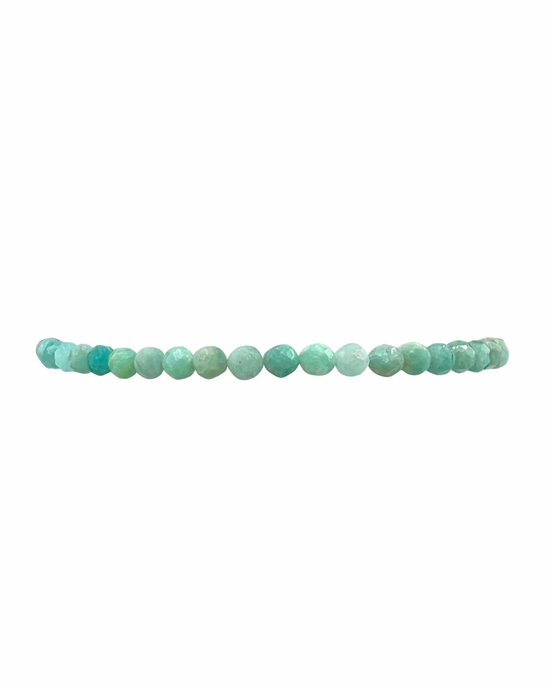 A string of turquoise-colored Karen Lazar Design Amazonite gemstones against a white background.