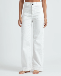 A person standing in ASKK NY's Sailor Pant - Twill in Ivory against a neutral background.