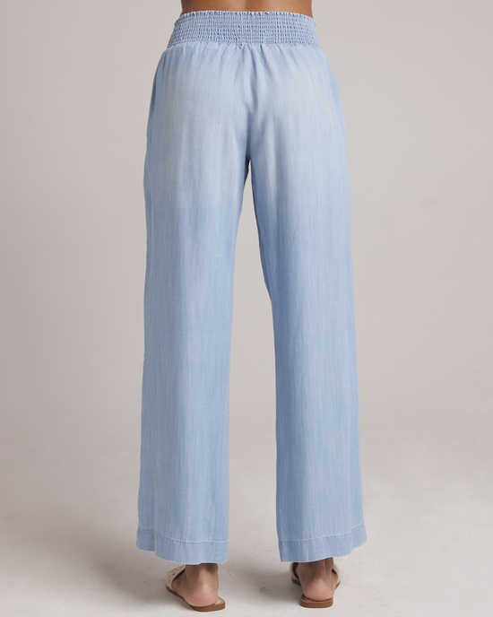 Bella Dahl Smocked Waist Wide Leg Pant in Caribbean Wash with a high-waisted, elastic waistband from the back view.