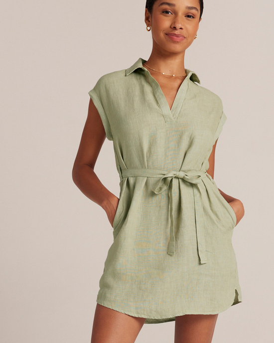 Woman posing in a light green, belted, sleeveless Bella Dahl Belted Tunic Shirtdress in Pale Palm with a collar.