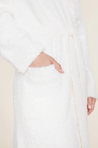 Person wearing a Barefoot Dreams Cozychic Solid Robe in Pearl with hand partially inserted in a pocket.