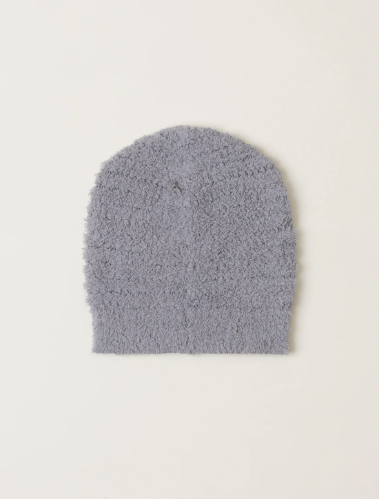 A single gray CC Boucle Beanie in Pewter made of polyester microfiber laid flat on a white background by Barefoot Dreams.