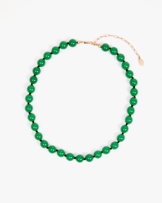 Clare V. Beaded Glass Strand in Emerald necklace with a lobster claw closure on a white background.