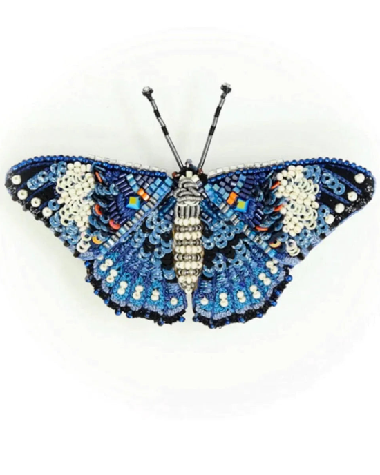 A Blue Calico Cracker Butterfly Brooch Pin handmade jewelry piece made from various colorful beads by Trovelore.