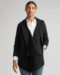 Woman modeling a Margaret O'Leary St. Claire in Black cashmere cardigan and white blouse.